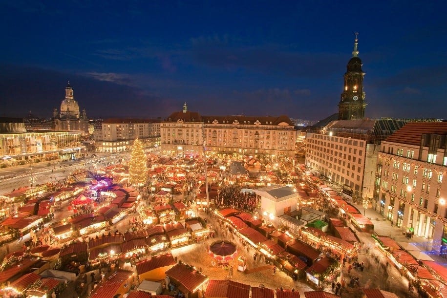 The town square of Dresden, Germany at night with the Christmas Market in the middle